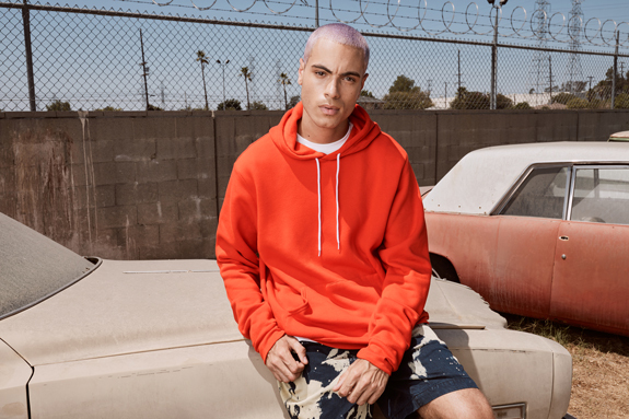 The Bella+Canvas 3719 unisex sponge fleece pullover hoodie in the color “poppy”.